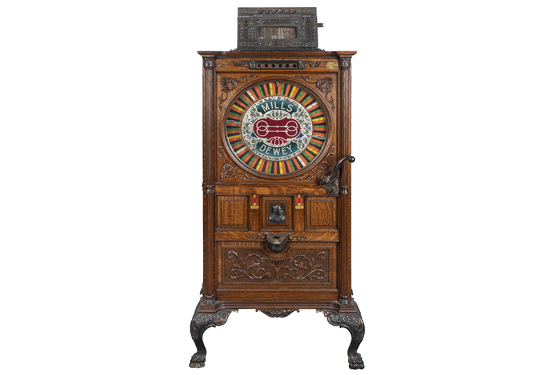 Mills 25 Cent Dewey Upright Slot Machine.
